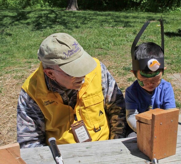Missouri Master Naturalist and young boy build a bluebird nesting box