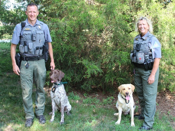 Corporals Andrew Feistel and Susan Swem with K9s Titan and Astro