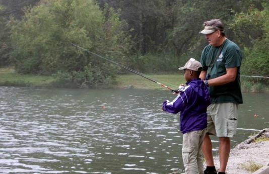 teaching boy to fish