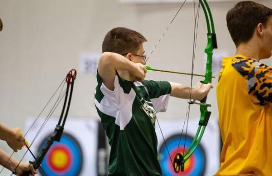 Young archer practices target shooting
