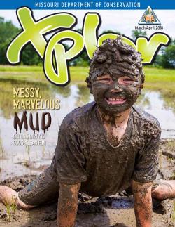Boy covered in mud